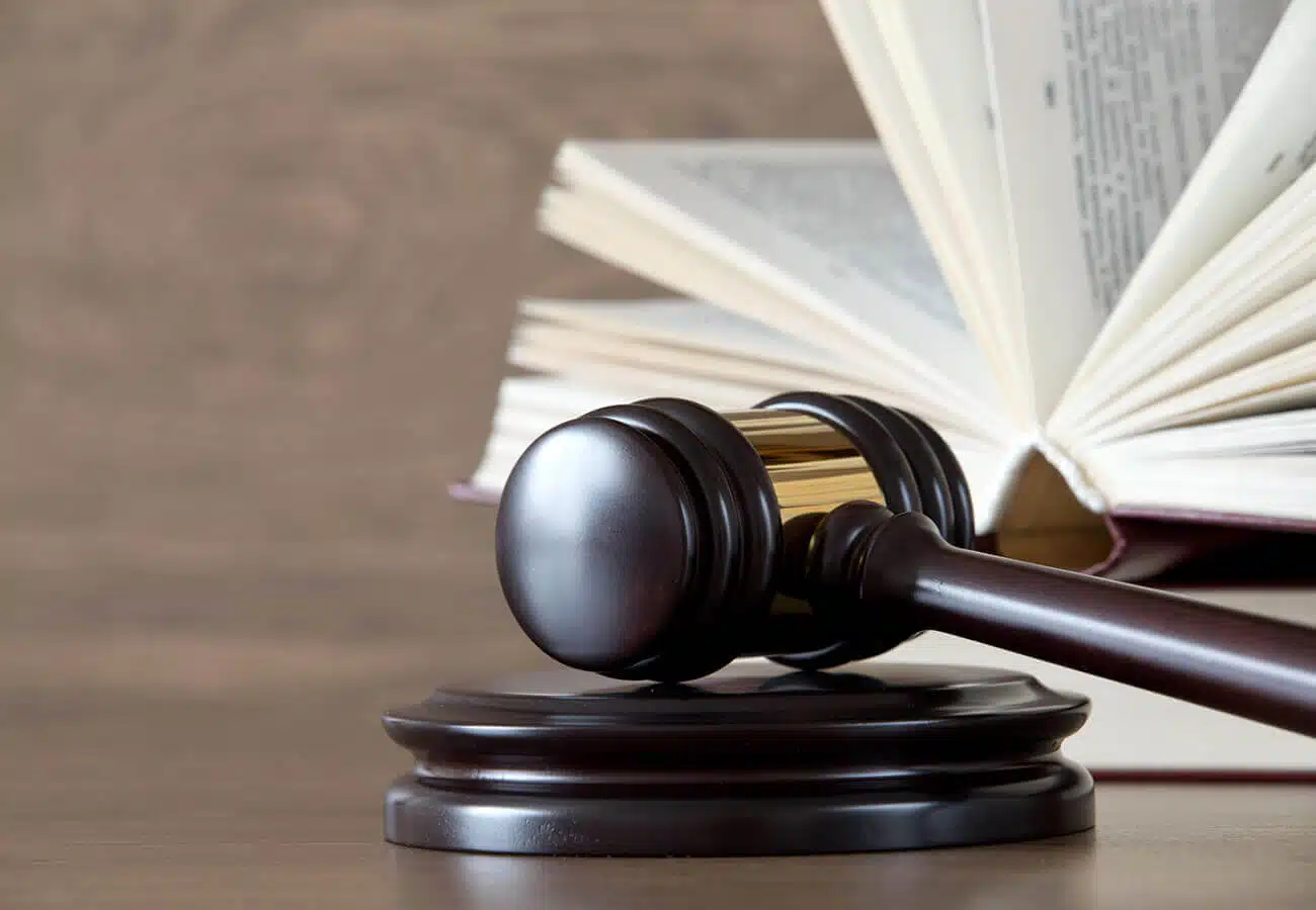 wooden gavel and books