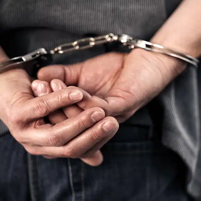 Criminal in handcuffs DUI Penalties In University Lakes Justice Court Cases