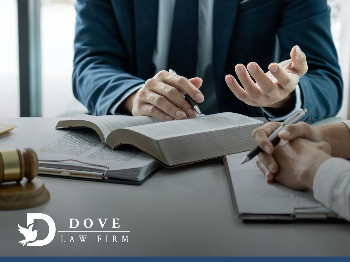 An attorney discussing legal strategies to defend against accusations in Arizona at Dove Law Firm
